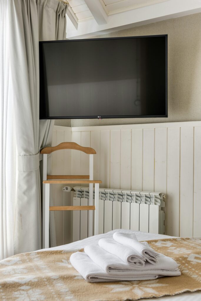 Traveletty - Guide to Affordable Accommodation - fresh towels on a table in a hotel room