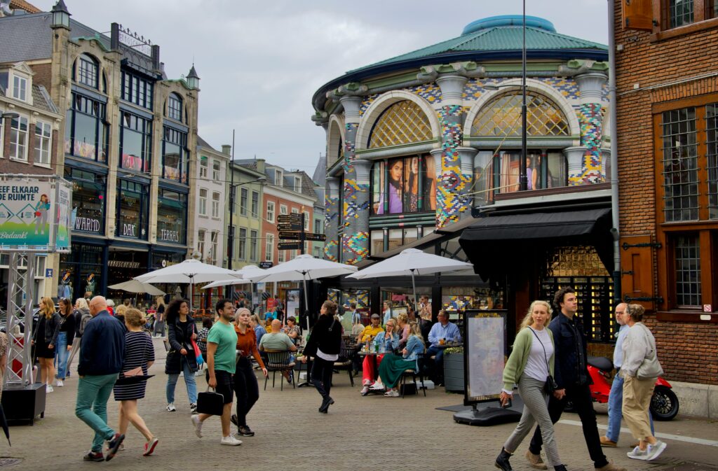 Cheap Travel Food Tips - Eat Like a Local - A group of people dining outside at local restaurants