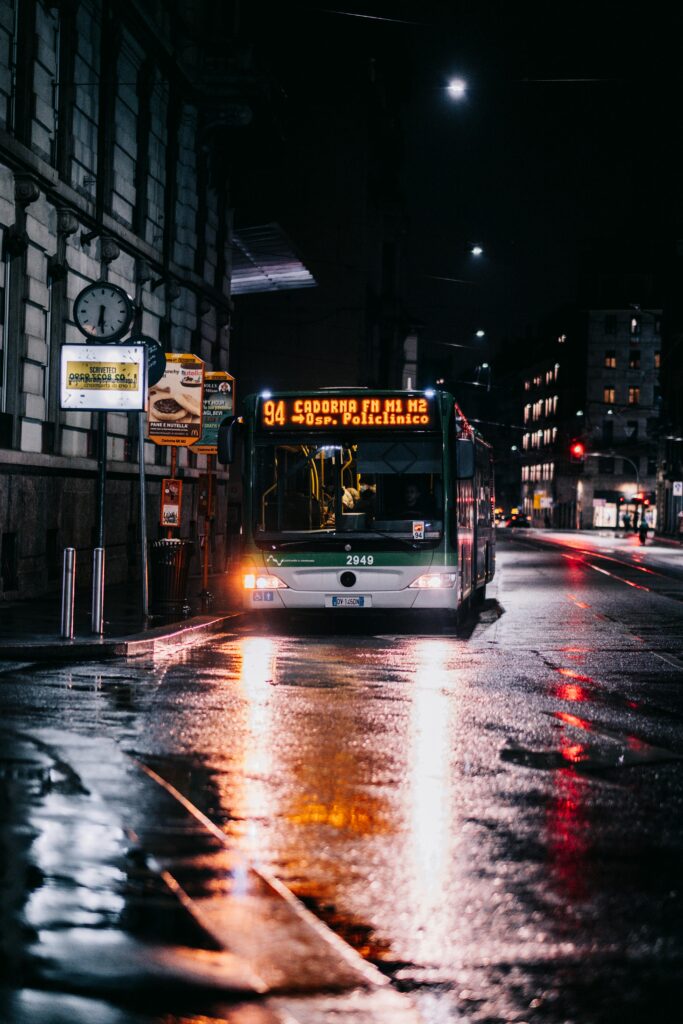 Traveletty - Public Transport for Travelers - a bus on the street at night time