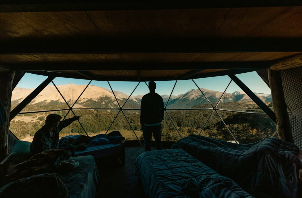 Traveletty - Bubble Domes - two guests inside a bubble dome tent hotel admiring the view