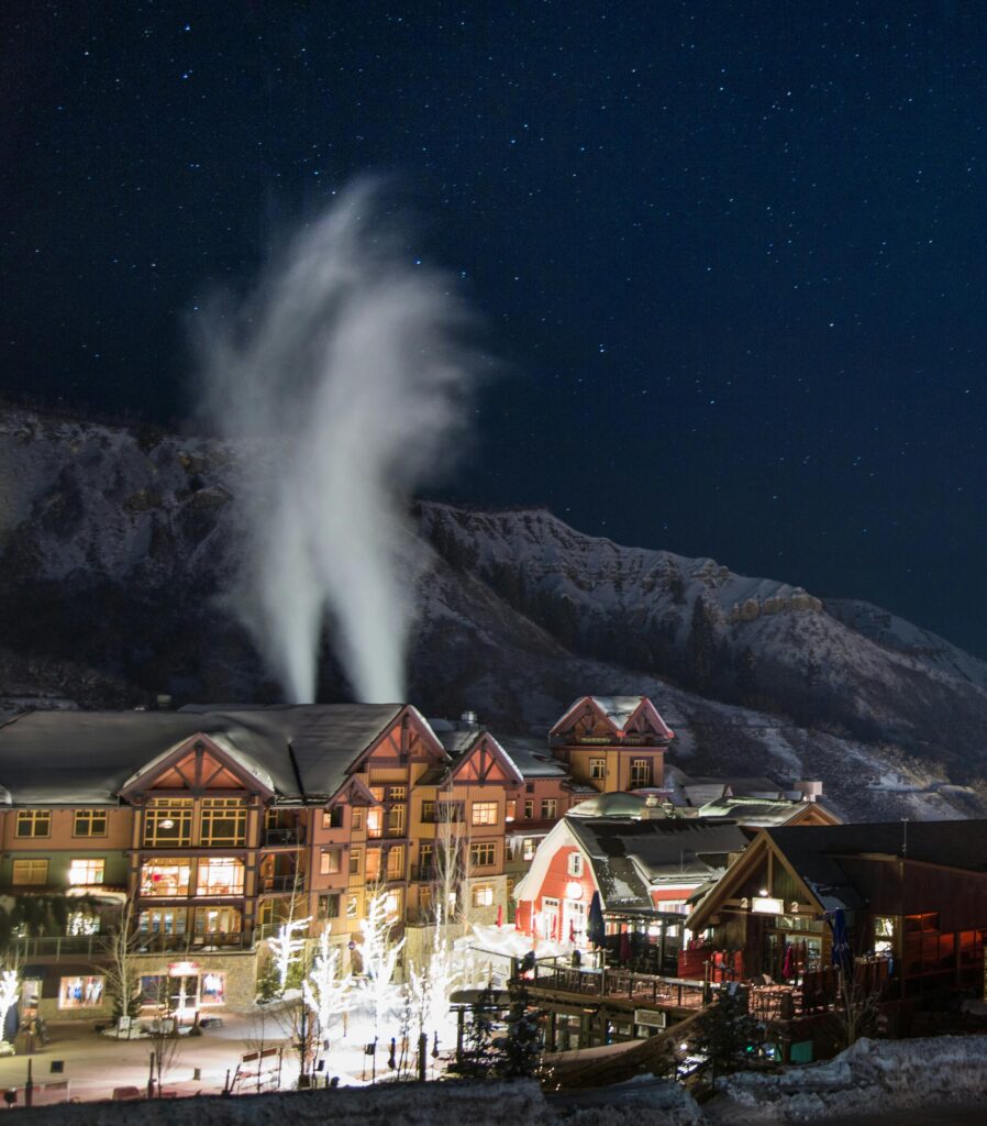 Traveletty - Ski Resorts - High angle shot at night of a beautiful ski resort 