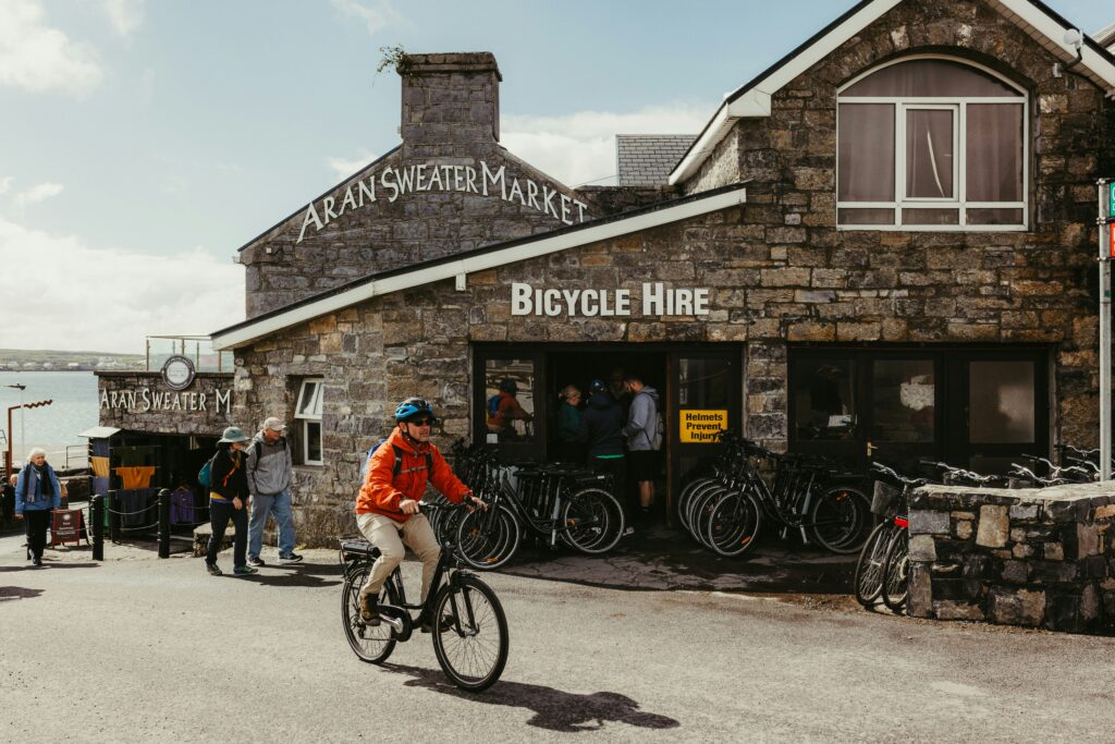 Traveletty - Budget Travel Transportation - A tourist riding a bicycle that he rented