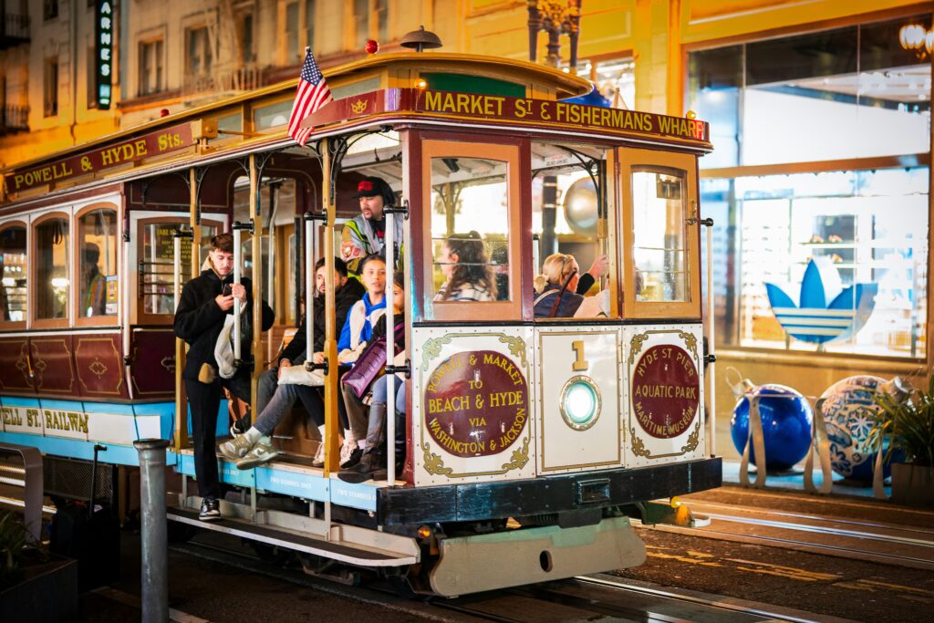 Traveletty - Budget Travel Transportation - A low cost cable car with passengers at night