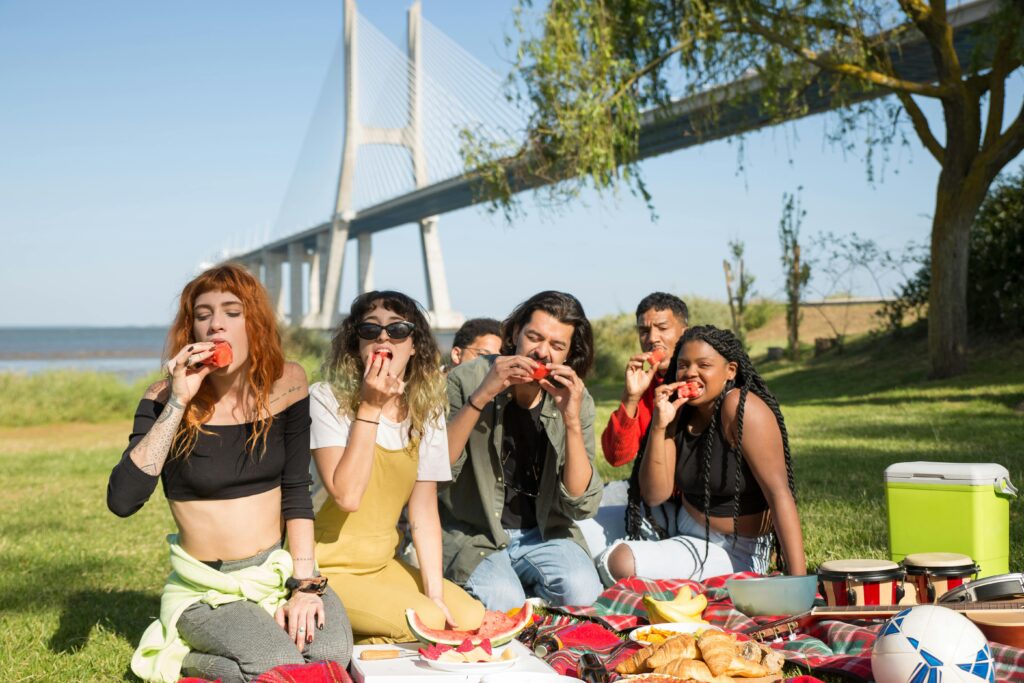 raveletty - Urban Parks for Picnicking - A group of people enjoying their picnic.