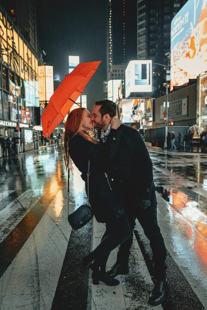Traveletty - Romantic Travel Destination - couple kissing in the middle of the street of New York City