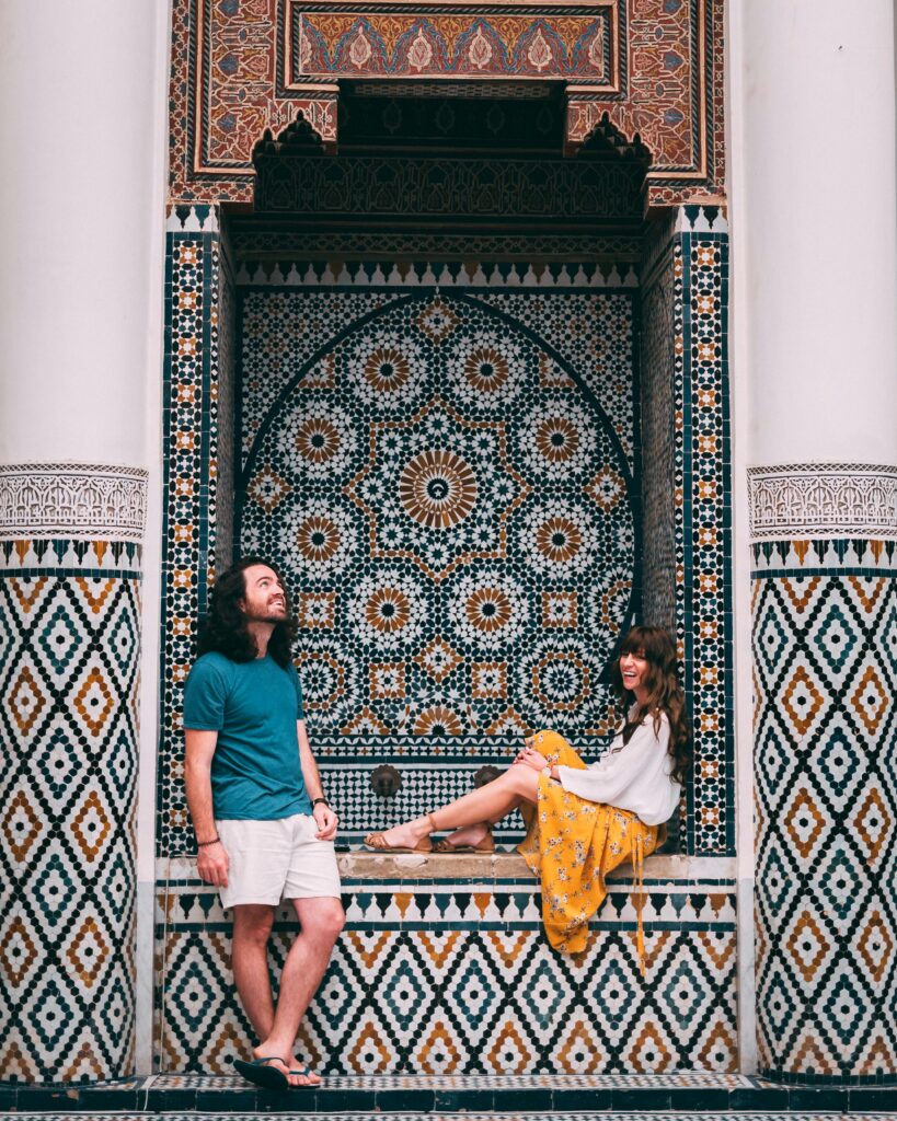 Traveletty - Romantic Travel Destination - couple posing for the camera in a tourist spot in Marrakech Morocco